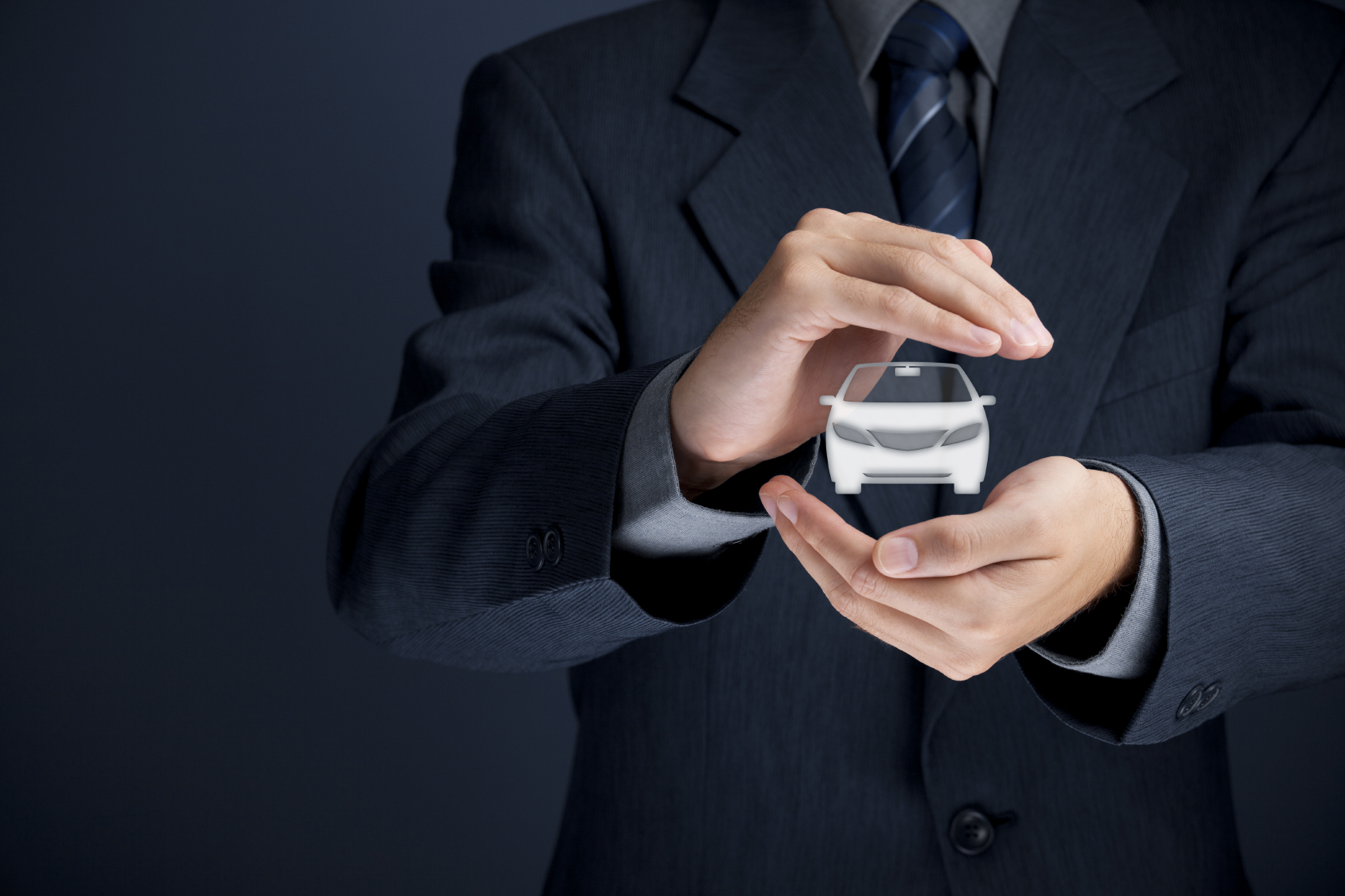 Car (automobile) insurance and collision damage waiver concepts. Businessman with protective gesture and icon of car.